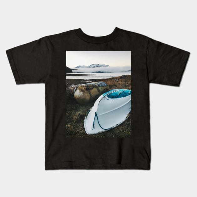 Old Gas Tank and White Boat Lying in Brown Grass on Cold Foggy Winter Day Kids T-Shirt by visualspectrum